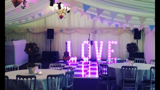 LOVE sign with bunting and pastel decor